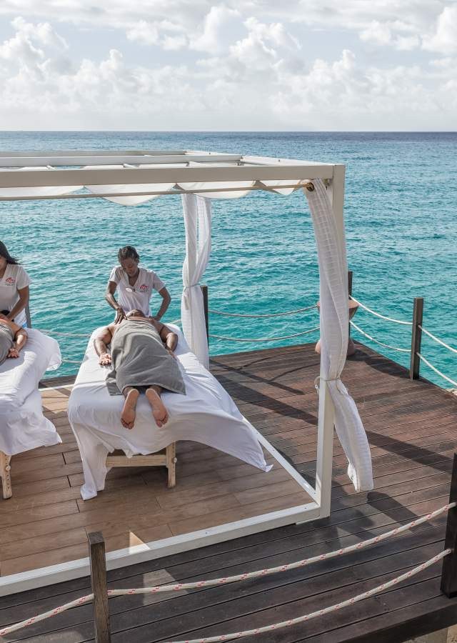 Mobile massage setup on an ocean deck