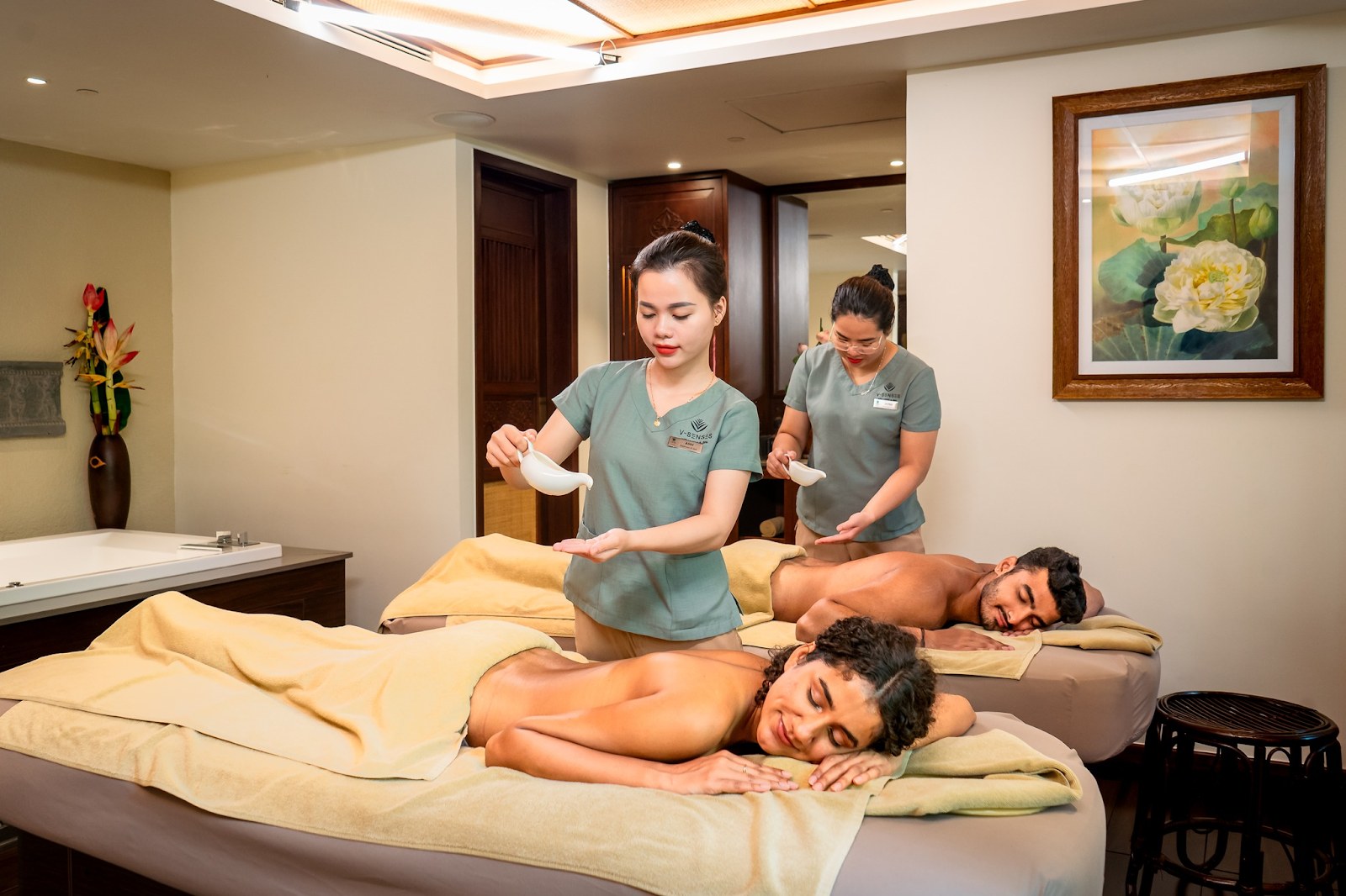 Professional massage treatment room with two massage tables